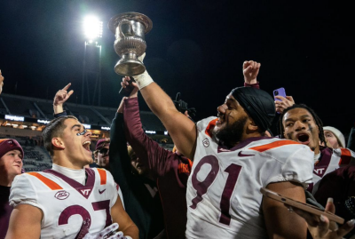 Hokie players hoist the Commonwealth Cup