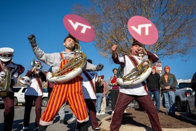 The Marching Virginians split into small groups and performed for tailgaters on Nov. 13, raising money for the annual Hokies for the Hungry food drive. Photo by Thomas Miller.