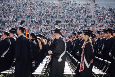 Students at commencement in Lane Stadium